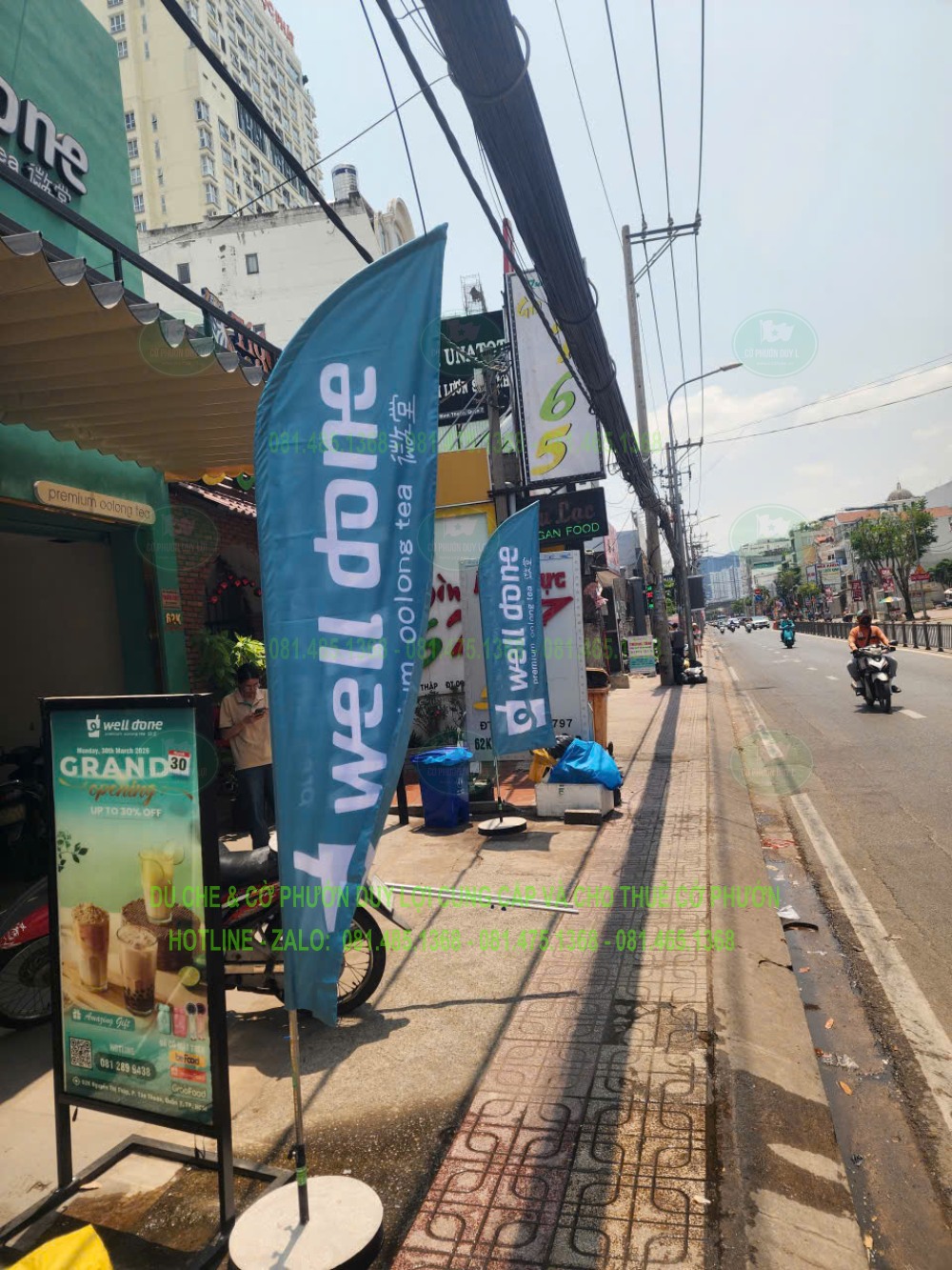 Cờ well done tông xanh đồng bộ với nhận diện quán trà